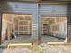 Two-car garage with ample space, featuring concrete flooring and unfinished drywall at 1025 Coldspring Circle, Durham, NC 27705