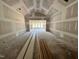 Spacious living room under construction featuring drywall, high ceilings, and natural light at 1025 Coldspring Circle, Durham, NC 27705