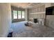 Spacious unfinished living room with multiple windows letting in natural light at 1025 Coldspring Circle, Durham, NC 27705