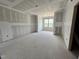 Living room featuring unfinished drywall with windows allowing for natural light at 1025 Coldspring Circle, Durham, NC 27705