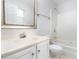 Bright bathroom featuring a vanity with a framed mirror and a shower-tub combo at 105 Sir Richard Ln, Chapel Hill, NC 27517