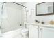 Bathroom featuring a shower-tub combination, a white vanity, and modern fixtures at 105 Sir Richard Ln, Chapel Hill, NC 27517