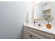 Clean bathroom with a white vanity, framed mirror, and decor accents at 105 Sir Richard Ln, Chapel Hill, NC 27517