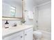 Bathroom featuring white cabinets, white walls, a sink, and shower-tub combination at 105 Sir Richard Ln, Chapel Hill, NC 27517