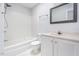 Bathroom featuring a shower and tub combo and a vanity with a framed mirror at 105 Sir Richard Ln, Chapel Hill, NC 27517