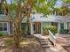 Charming townhome entrance with inviting walkway and well-maintained landscaping, perfect for curb appeal at 105 Sir Richard Ln, Chapel Hill, NC 27517