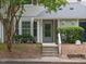 Inviting front entrance with a well-manicured lawn and gray exterior at 105 Sir Richard Ln, Chapel Hill, NC 27517