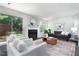 Stylish living room featuring ample seating, a fireplace, and natural light at 105 Sir Richard Ln, Chapel Hill, NC 27517