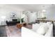Spacious living area with dark hardwood floors, cozy seating, and lots of natural light at 105 Sir Richard Ln, Chapel Hill, NC 27517