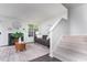 Relaxing living room with modern fireplace, comfortable seating, and staircase at 105 Sir Richard Ln, Chapel Hill, NC 27517