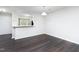 Open-concept dining area with hardwood floors, white walls, and modern lighting at 105 Sir Richard Ln, Chapel Hill, NC 27517