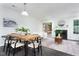Open concept living and dining area featuring a fireplace and hardwood floors at 105 Sir Richard Ln, Chapel Hill, NC 27517