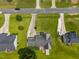 The birds-eye-view showcases a house with nice landscaping and a quaint outdoor seating area on the back deck at 106 Oak Rd, Butner, NC 27509