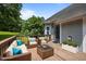 Outdoor deck with wicker patio furniture, seating, and a view of the yard at 106 Oak Rd, Butner, NC 27509