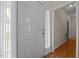 Bright entryway featuring wood floors, and a doorway leading into another room at 106 Oak Rd, Butner, NC 27509
