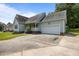 Charming single-story home with a manicured lawn and attached garage, perfect for suburban living at 106 Oak Rd, Butner, NC 27509