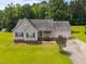 Charming single-story home with a manicured lawn and attached garage, perfect for suburban living at 106 Oak Rd, Butner, NC 27509