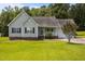 Charming single-story home with a manicured lawn and attached garage, perfect for suburban living at 106 Oak Rd, Butner, NC 27509