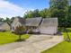 Inviting single-story home with a spacious driveway and well-maintained front yard at 106 Oak Rd, Butner, NC 27509