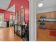 Warm living area with wood floors transitions to a kitchen featuring stainless steel appliances at 106 Oak Rd, Butner, NC 27509