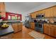 Bright eat-in kitchen features stainless steel appliances and warm wood cabinetry at 106 Oak Rd, Butner, NC 27509