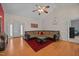 Spacious living room boasts a vaulted ceiling, hardwood floors, and ample seating at 106 Oak Rd, Butner, NC 27509