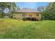 Expansive backyard with a wooden deck, ideal for outdoor entertaining and recreation at 109 Springwood Dr, Wake Forest, NC 27587