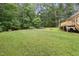 Spacious backyard with a fire pit area, perfect for outdoor gatherings and relaxation at 109 Springwood Dr, Wake Forest, NC 27587
