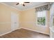 This bright bedroom features wood floors, trim, natural light, and a double-door closet at 109 Springwood Dr, Wake Forest, NC 27587