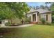 Charming home featuring a fountain and a lush landscaped yard with a well-maintained lawn at 109 Springwood Dr, Wake Forest, NC 27587