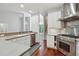 Spacious kitchen features stainless steel appliances, lots of cabinets, and a large island at 109 Springwood Dr, Wake Forest, NC 27587