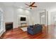 Spacious living room featuring a fireplace, hardwood floors, and an open layout at 109 Springwood Dr, Wake Forest, NC 27587