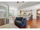 Open-concept living room with hardwood floors and kitchen access, great for entertaining guests at 109 Springwood Dr, Wake Forest, NC 27587