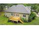 Exterior of home featuring wood deck overlooking lush green backyard at 109 Springwood Dr, Wake Forest, NC 27587