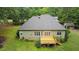 Exterior of home featuring wood deck overlooking lush green backyard at 109 Springwood Dr, Wake Forest, NC 27587