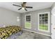 Simple bedroom features large windows providing lots of natural light at 1112 Newberry Dr, Mebane, NC 27302