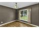Dining room with hardwood floors and a window letting in natural light at 1112 Newberry Dr, Mebane, NC 27302