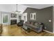 Cozy living room featuring hardwood floors, a fireplace, and a ceiling fan at 1112 Newberry Dr, Mebane, NC 27302