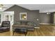 Comfortable living room with hardwood flooring and neutral decor, inviting relaxation at 1112 Newberry Dr, Mebane, NC 27302