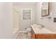 Bathroom features a vanity with tile countertop and a tub with shower at 1209 Bobbitt Dr, Garner, NC 27529