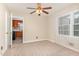 Bedroom with neutral walls, carpet flooring, and ceiling fan at 1209 Bobbitt Dr, Garner, NC 27529