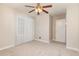 Inviting bedroom with neutral walls, carpet flooring, and a classic ceiling fan at 1209 Bobbitt Dr, Garner, NC 27529