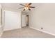 Bedroom with neutral walls, carpet flooring, closet, and ceiling fan at 1209 Bobbitt Dr, Garner, NC 27529