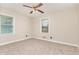 Bedroom with neutral walls, carpet flooring, and natural light at 1209 Bobbitt Dr, Garner, NC 27529