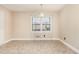 Bright dining room features neutral walls, tile floor, and decorative chandelier at 1209 Bobbitt Dr, Garner, NC 27529
