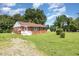 Traditional brick house with inviting front entrance and manicured lawn, a perfect Gathering home at 1209 Bobbitt Dr, Garner, NC 27529