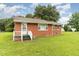 Classic brick house featuring a secure ADT system and lush green lawn at 1209 Bobbitt Dr, Garner, NC 27529