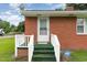 Close up of rear entrance with secure ADT system and white railing at 1209 Bobbitt Dr, Garner, NC 27529