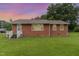 Cozy brick home featuring well-kept lawn and secure ADT protection at 1209 Bobbitt Dr, Garner, NC 27529
