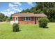 Charming brick home with well-maintained lawn and mature trees offering classic curb appeal at 1209 Bobbitt Dr, Garner, NC 27529